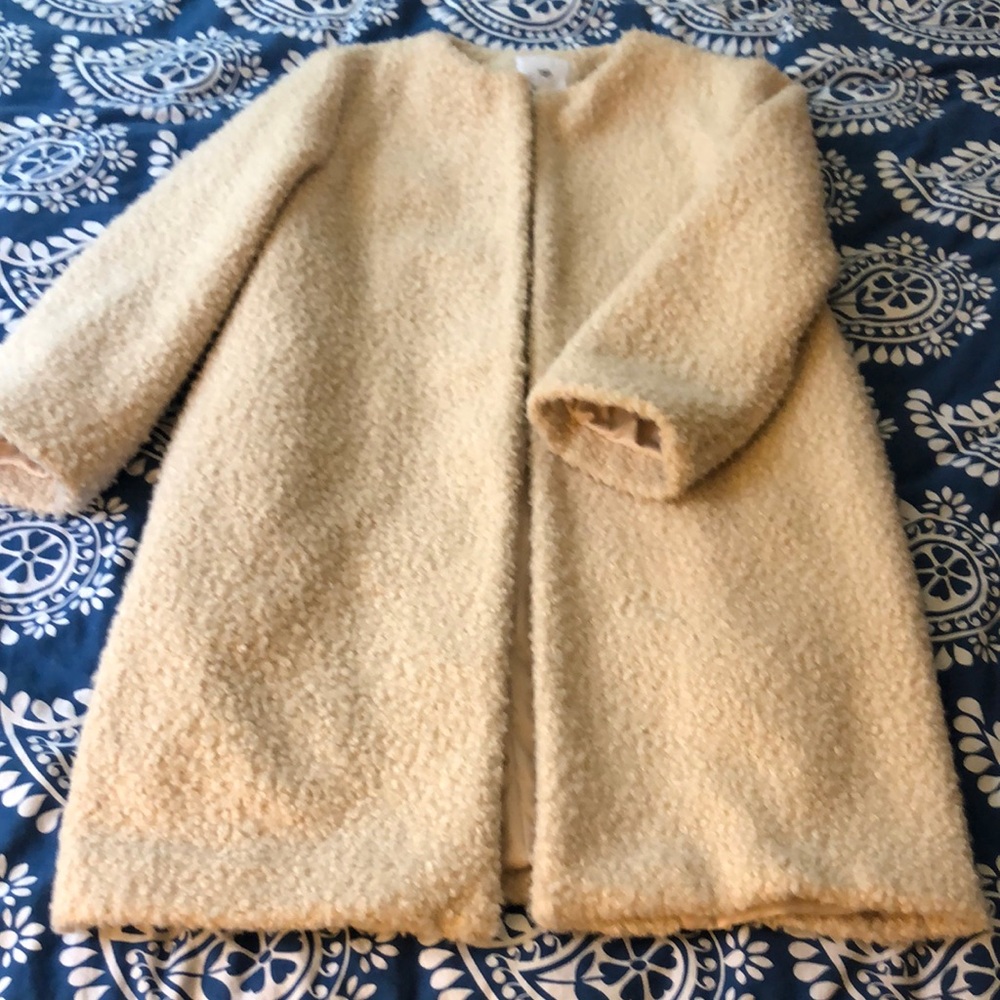 Ming xs winter coat in an oatmeal color.